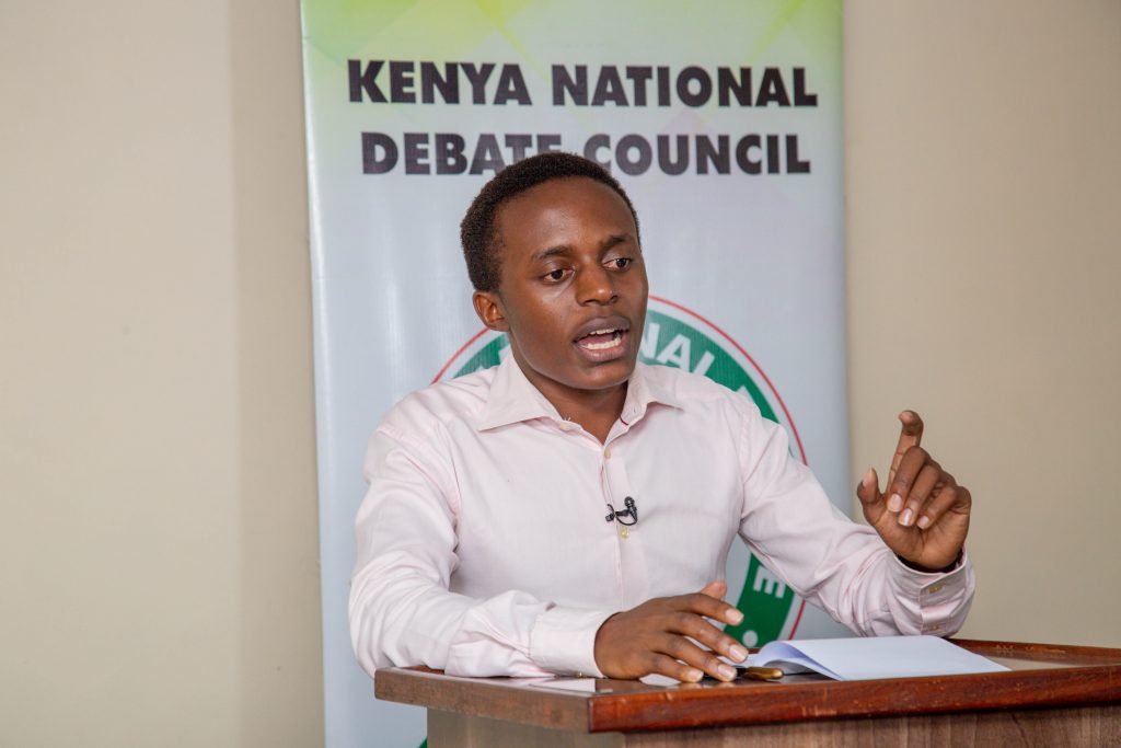 Bonaventure Ogeto, President of the JKUAT Debate Society and a 4th year student pursuing B.Sc. Mathematics and Computer Science proposes his argument at a past debate. 