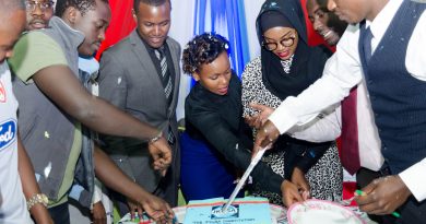 Student Leaders, Committee Members and students cutting the cake to mark the promulgation of the JKUSA Constitution